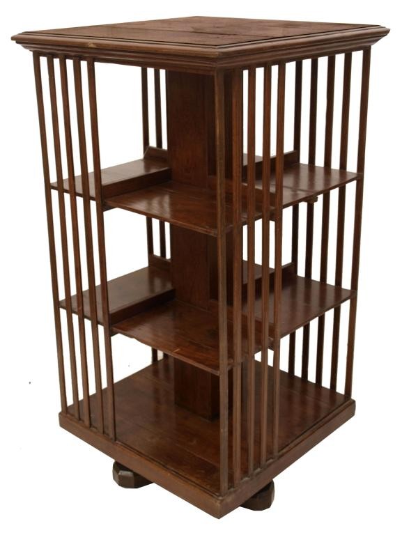 ANTIQUE BRITISH COLONIAL REVOLVING TEAK BOOKCASE: Revolving teakwood bookcase, 19th c., slatted sides with open shelving set on four rectangular flat legs, 43.75"h, 24"w, 24"d, (R6)