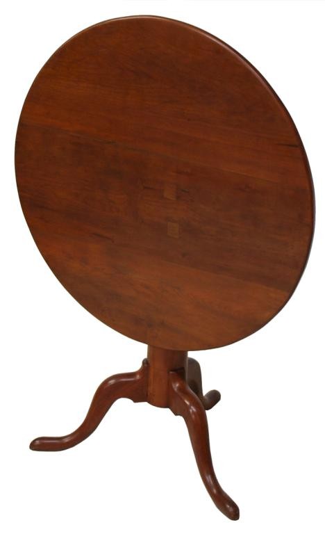 AMERICAN CHERRYWOOD TILT TOP TEA TABLE: American tilt top cherrywood tea table, mid 19th c., circular top on tripod base, old inset repairs, locking mechanism not complete, 26.5"h, 31"d