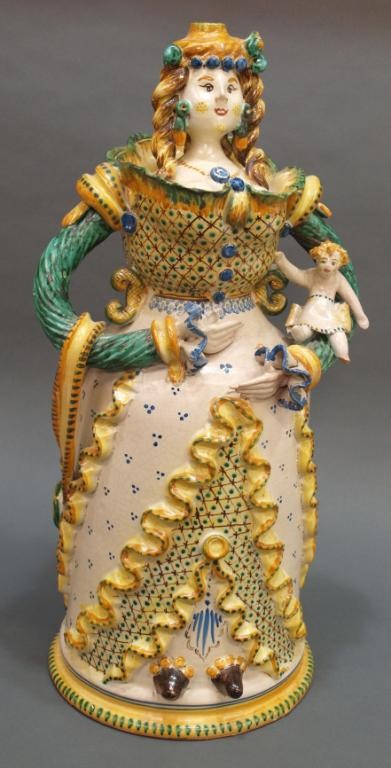 ITALIAN FAIENCE POTTERY MOTHER FIGURE & CHILD: Large Italian faience pottery mother figure holding a child, signed ?Scagliola Grottaglie (Tri), Italy, glue restoration to bow, child lacking foot, originally formed as a lamp base with hole at top a