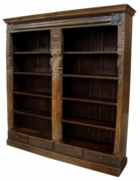 LARGE BOOKCASE COMPOSED OF 18TH C. ELEMENTS: Large bookcase of rectangular form in two fixed sections, India, moulded cornice and later case with ten shelves, all faced with 18th c. wood elements having paint remnants and sparse foliate carving,