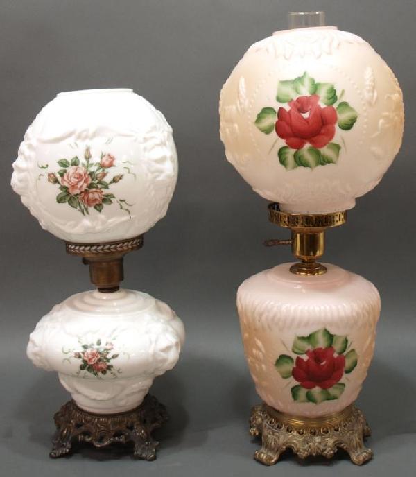(2)GONE WITH THE WIND STYLE TABLE LAMPS IN RELIEF: (lot of 2) Gone with the Wind style lamps including: (1) of milk glass molded in relief with lion masks and embellished with roses, 20"h; (1) molded with covered wagons and wheat, large reserves hand
