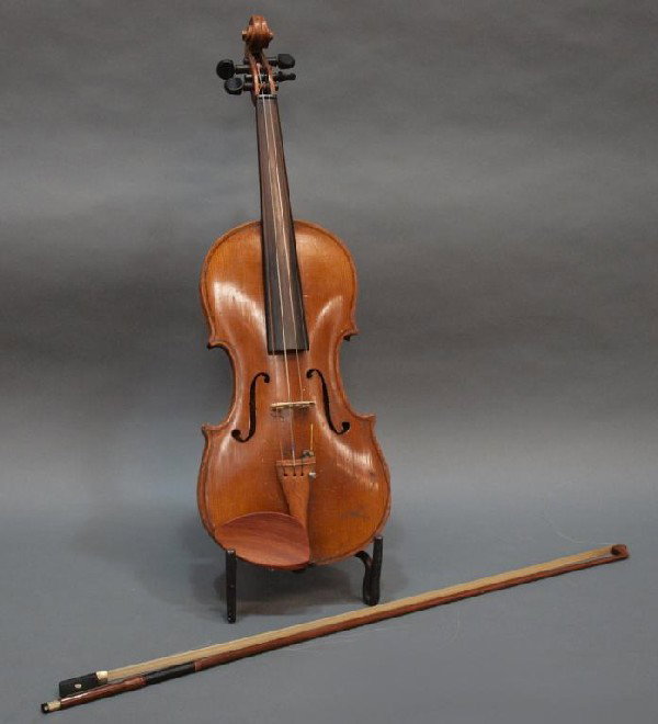 GERMAN STRADIVARIUS STYLE VIOLIN, BOW & CASE: German violin, early 20th c., bearing interior printed label "Antonius Stradivarius...", restoration, wear, violin: 24"l, 8"w, accompanied by a bow and old rosin in a black hard case, case: 31"l, 9.5"