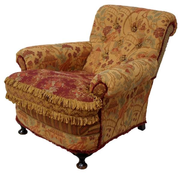 DESIGNER CUSTOM MADE ARM CHAIR,E.J. VICTOR/ BOLTON: Custom designed upholstered arm chair, Carol Hicks Bolton and E.J. Victor, fabric in an oriental motif depicting monkeys, pagodas, and flowers, the seat cushion in foliate red with fringe, two flat bu