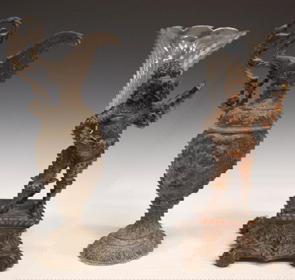 FIGURAL METAL & GLASS EPERGENE & METAL EWER: (lot of 2) Renaissance style figural patinated metal and glass epergne, late 19th c., a fancifully costumed boy with sword standing upon a base terminating in four scrolled toes, behind him a single c