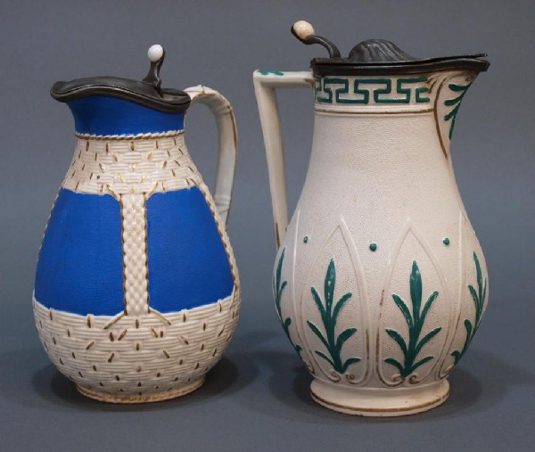 19TH C. WILLIAM BROWNFIELD COBRIDGE STONEWARE JUGS: (lot of 2) English stoneware jugs, 19th c., both examples by William Brownfield of Cobridge, Staffordshire: (1) in the Argos pattern having a textured cream ground accented in green, 9"h; (1) 'Westmin