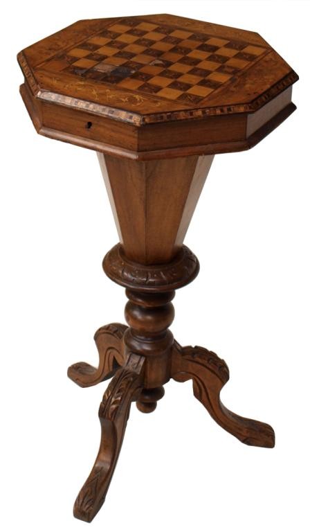 VICTORIAN MARQUETRY SEWING TABLE, CHESS GAME TOP: Victorian walnut work table with inlaid chess top, c. 1895, the hinged lid of octagonal form opening to reveal a selection of sewing compartments, supported on a tapering pedestal on a tripod cabriole