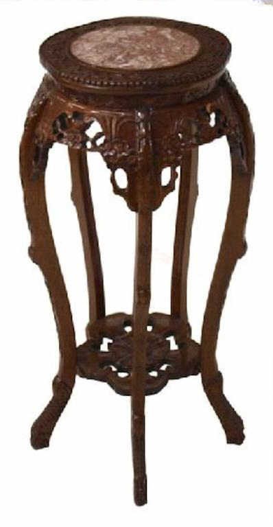 CHINESE DRAGON & FLORAL MARBLE TOP PEDESTAL: Chinese marble top pedestal, a circular rouge marble table inset in the frame carved with floral ornamentation, curved legs joined by a floriform shelf, rising on stylized dragon feet, 36"h, 17"d