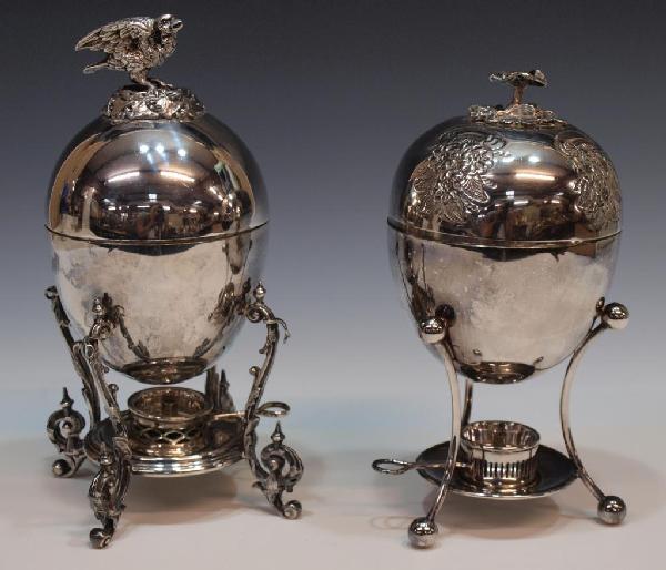 (2) ELABORATE SILVER PLATE EGG CODDLERS, SHEFFIELD: (lot of 2) Fine silverplate egg coddlers, each of ovoid form raised on four legs above a spirit lamp, both fitted with a (4) egg coddler on the interior: (1) Atkin Bros., Sheffield plate example havin