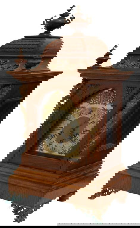 ANTIQUE JUNGHANS TRIPLE CHIMING MANTLE CLOCK: Fancy walnut case chiming shelf clock, likely German, c. 1895, an urn form final surmounting a roof top decorated at the front with ormolu, single glazed door flanked by classical ormolu figures, the