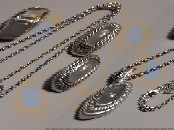 DAVID YURMAN 14KT & MOONSTONE JEWELRY ENSEMBLE: (lot of 5) David Yurman sterling silver and 14kt yellow gold jewelry ensemble comprising a (pair) of clip on earrings and (2pc) necklace and pendant, and (1) ring, size 5.75, each in the cable design