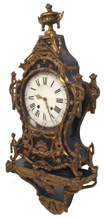 EARLY 18TH C LOUIS XV CLOCK & BRACKET, SWISS WORKS: Louis XV clock set on a matching bracket, Switzerland, 18th c., polychrome floral decorated case stamped L 6 and decorated with foliate formed ormolu, having a crown and bracket base, porcelain face w