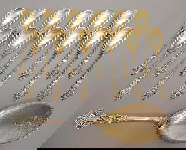 GEORGE SHARP GILDED STERLING SILVER ICE CREAM SET: (set of 12) Scarce American sterling silver ice cream service, George B. Sharp (1850-1874) for Robbins, Clark & Biddle, Philadelphia, comprising (1) master spoon with engraved design and (12) service