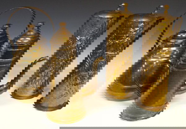 COLLECTION OF BRASS KETTLES & RELEIF TANKARDS: (lot of 4) Brass vessels including (2) teapots, one with strainer, and (2) brass tankards in relief depicting two scenes of discussion between military men and a high class gentleman, lid marked after