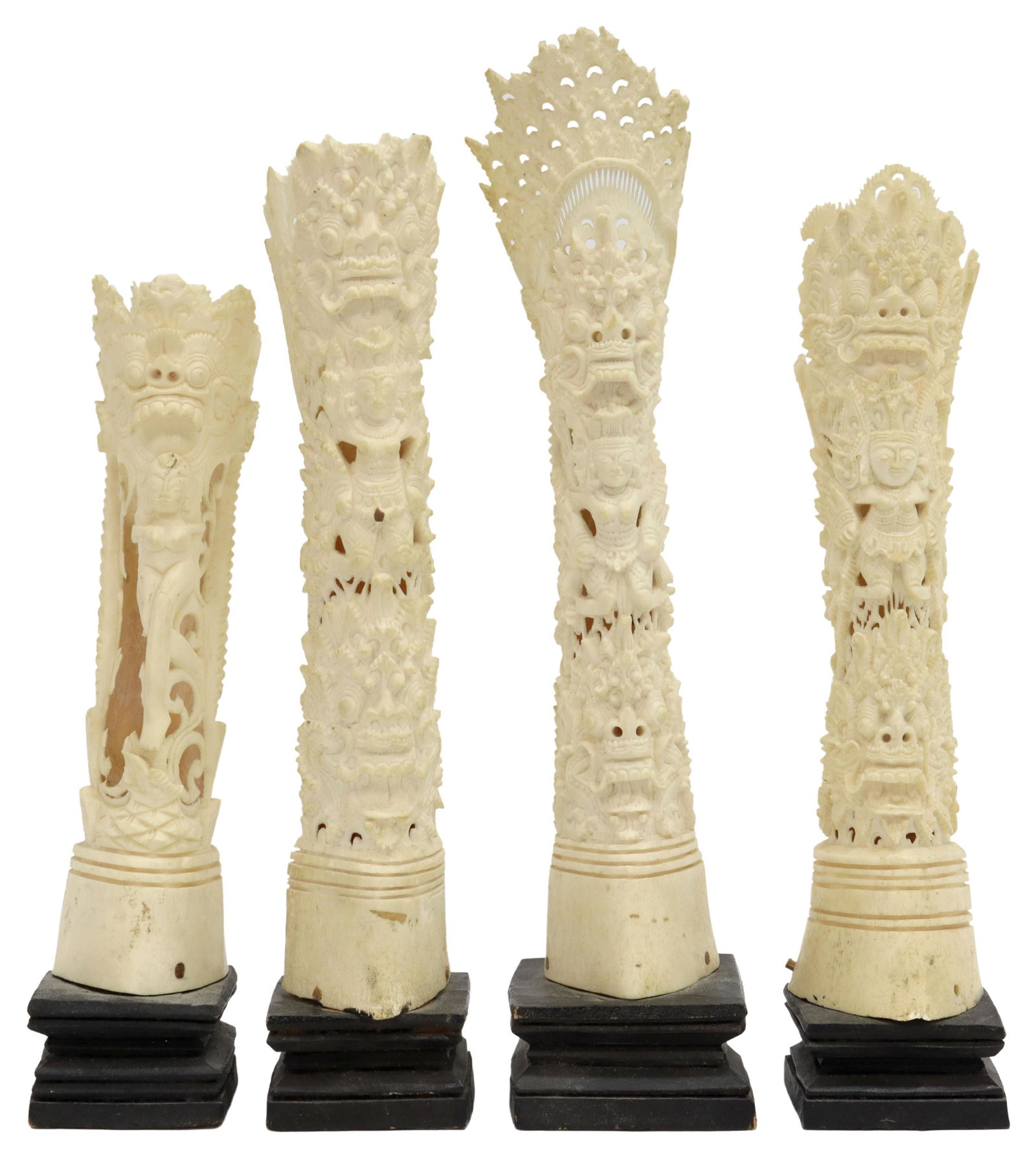 (4) SOUTHEAST ASIAN CARVED BONE DEITY TOTEMS: (lot of 4) Southeast Asian carved bone totems, intricately carved with deities and mythical figures, rising on painted pedestals, some crown loss and pedestal loss, some not secure on base, largest: a