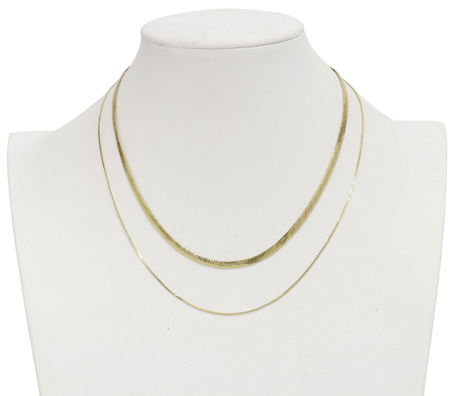 (2) ESTATE ITALIAN 14KT GOLD NECKLACES, SIGMA: (lot of 2) Estate Italian 14kt yellow gold necklaces: (1) Sigma, in a herringbone design to one side, textured scroll pattern to the other, slight bending, 16"l; (1) thin chain, 17.5"l; 9.3 grams tota