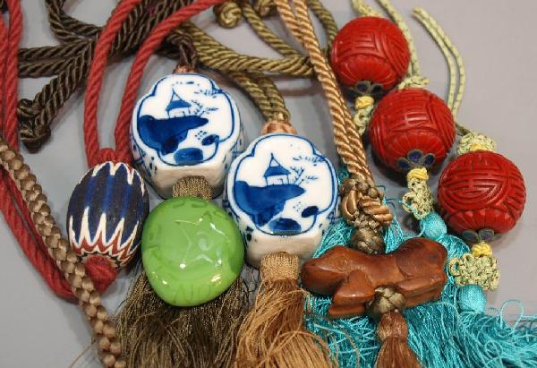 COLLECTION CHINESE & OTHER BEADS, LAPIS LAZULI: (lot) Chinese beaded cord necklaces and tassels, including (2) examples with blue and white porcelain, (1) with wood carved figure, additional beads, (1) faceted Lapis lazuli loose gemstone, 1lb total