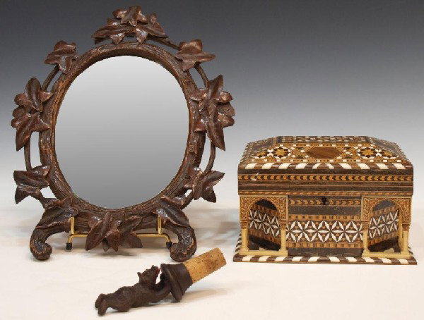 BLACK FOREST MIRROR & ARABESQUE DRESSER BOX: (lot of 3) (1) Black Forest carved oval mirror, ivy leaf motif, hook for hanging, minor wear to tips of leaves, 12.5"h; (1) Black Forest carved bottle stopper of a bear doing a handstand, 4.5"h; toget