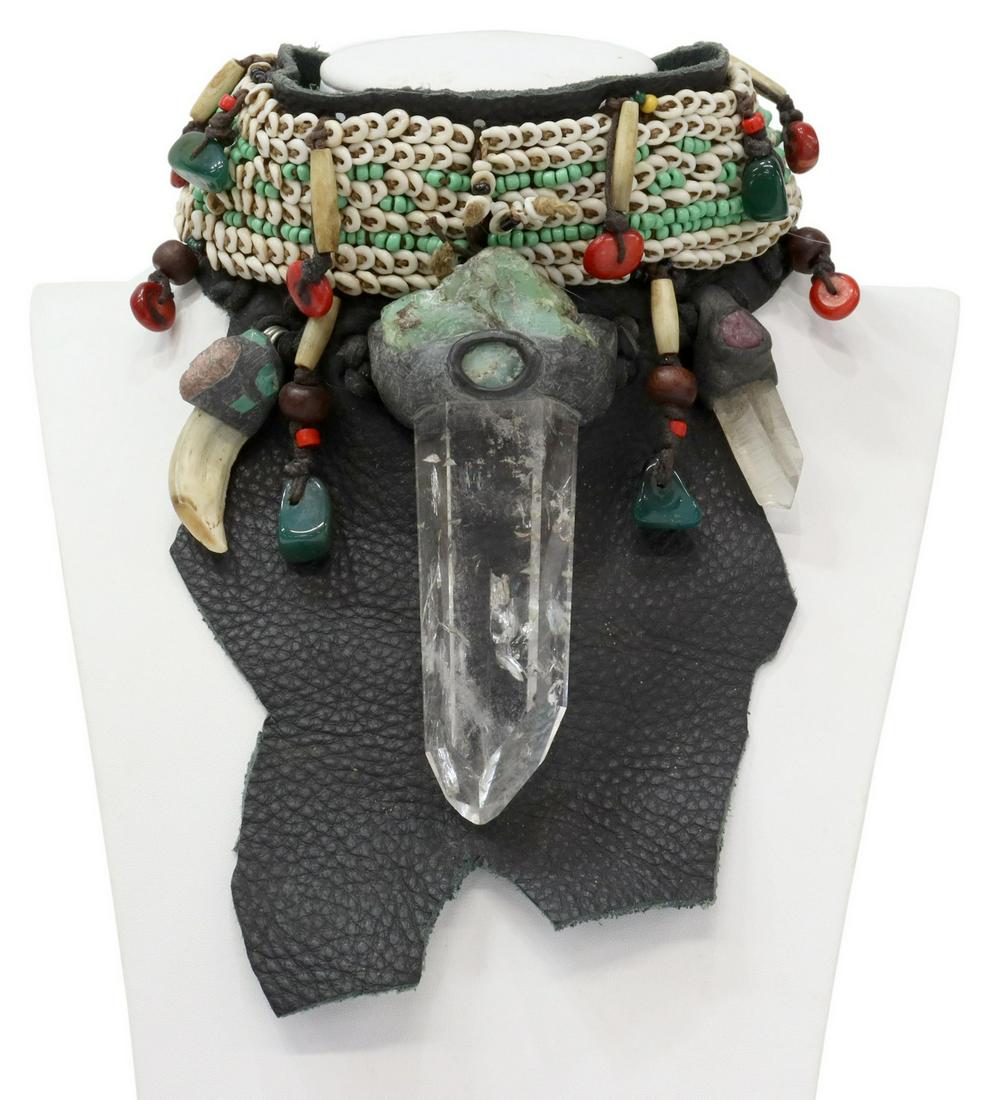 ANOTHAI HANSEN TRIBAL CHOKER, CRYSTAL & RAW GEM: Artisan one-of-a-kind wearable art tribal statement choker necklace, Anothai Hansen (Thailand/ New York, 20th c.), a large textured leather collar and bib, mounted with small cowrie shells, bone, turq
