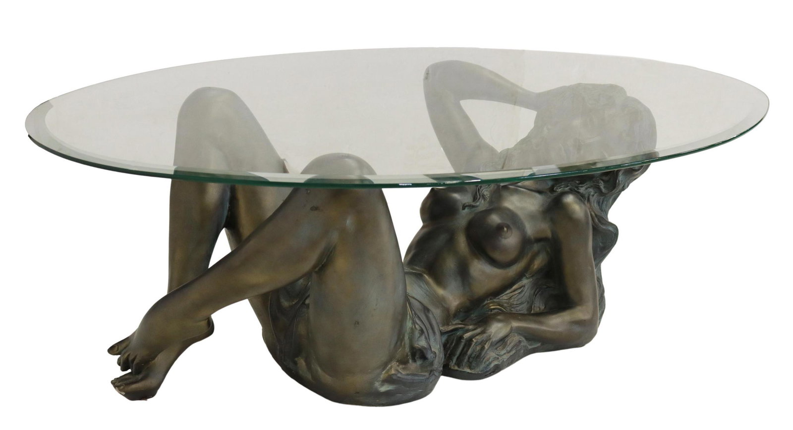 BRONZE DRAPED NUDE WOMAN & GLASS COFFEE TABLE: Modern figural bronze coffee table, late 20th c., beveled oval glass top, over semi-nude reclining woman, marked M Depose 08199 to base, approx 15.5"h, 47.25"l, 27.75"w Start Price: $400.00
