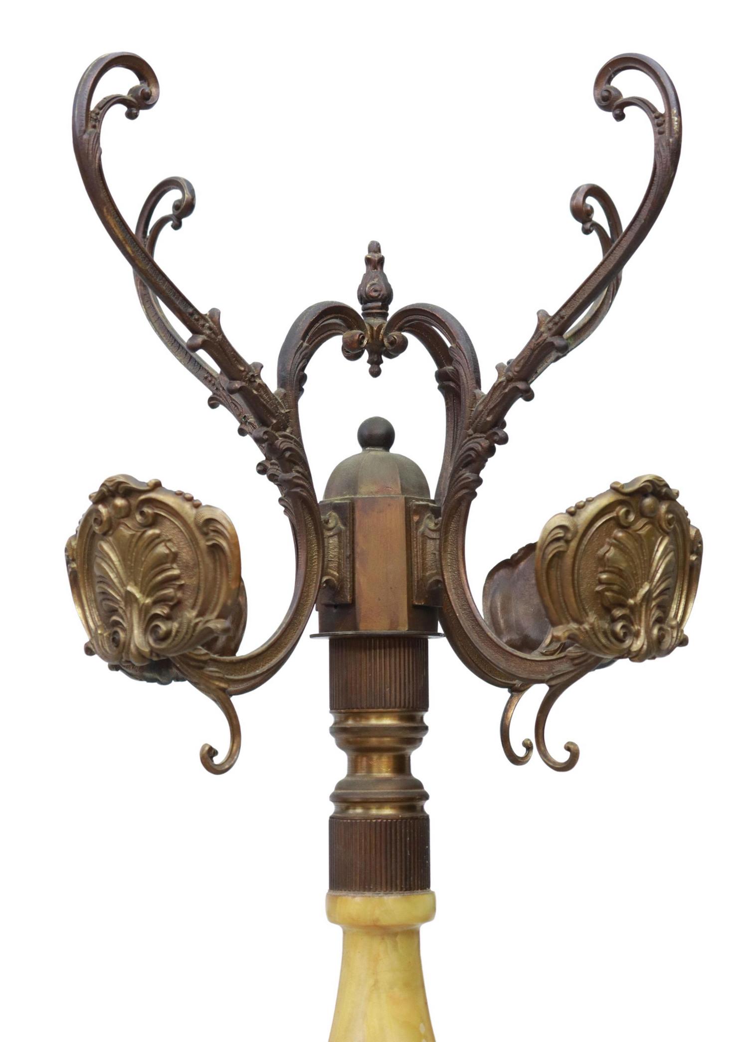 ITALIAN ONYX & PATINATED METAL DOLPHIN HALL TREE: Italian onyx and patinated metal standing hall tree, 20th c., having four scrolling arms terminating in coat and hat hooks, turned-form onyx standard, with medial dolphin detailing, rising on vasiform