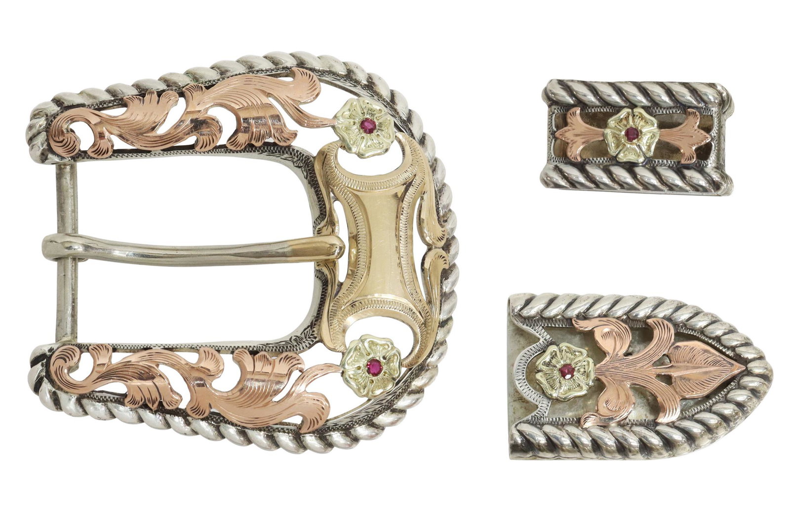 BOHLIN STERLING & 14KT GOLD RANGER BUCKLE SET: Western sterling silver and 14kt gold overlay ranger belt buckle set, Edward H. Bohlin, Hollywood, California, including: (one) tip, (one) keeper, (one) buckle, vacant shield, two-tone gold filigree, 