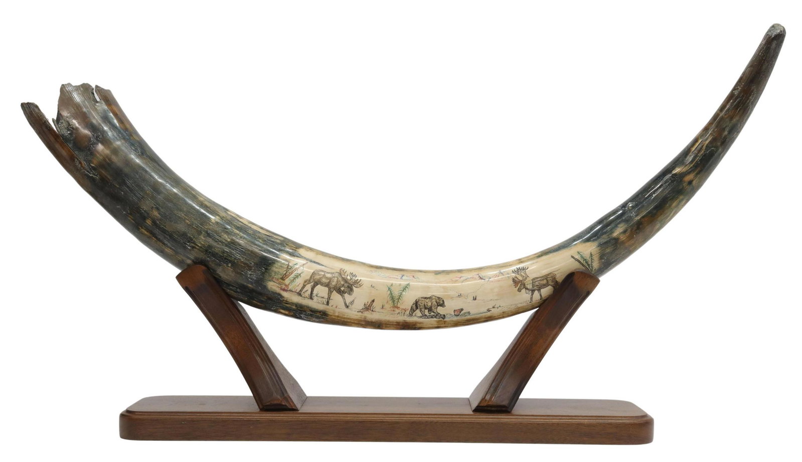 MASTODON TUSK, PAINTED MOOSE & BEAR, ALASKA: Mastodon tusk painted with an Alaska landscape depicting moose and a bear fishing, foliage and mountains in the background, signed below left Moose, "B. Merry (Bob Merry, Bob Merry Studios, Anchorage,