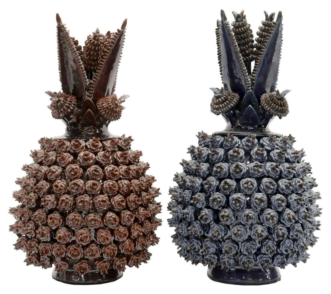 (2) EARTHENWARE PINEAPPLE URNS, MICHOACAN, MEXICO: (lot of 2) Glazed earthenware pineapple-form urns, Michoacan, Mexico, 20th c., (one) in a blue glaze, (one) in a brown glaze, with small losses and restoration to points on lid, approx 16"h, 6.5"diam;