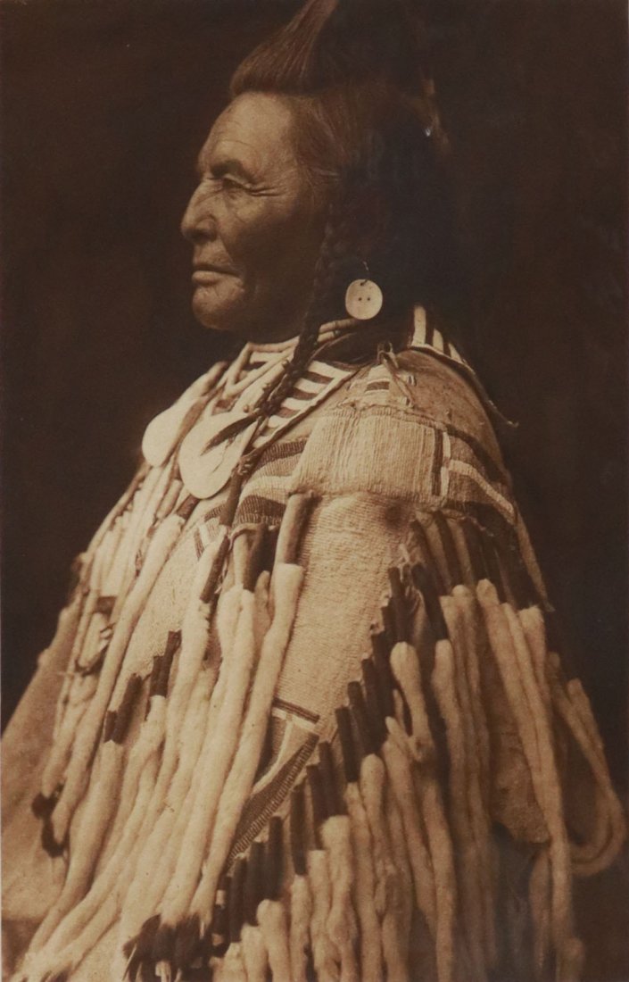 PHOTOGRAVURE PRINT AFTER EDWARD SHERIFF CURTIS: Framed intaglio photogravure print on paper, "Shot in the Hand, Apsaroke," numbered 70 / 228, after the original 1908 photograph by Edward Sheriff Curtis (American, 1868-1952) for "The North American 