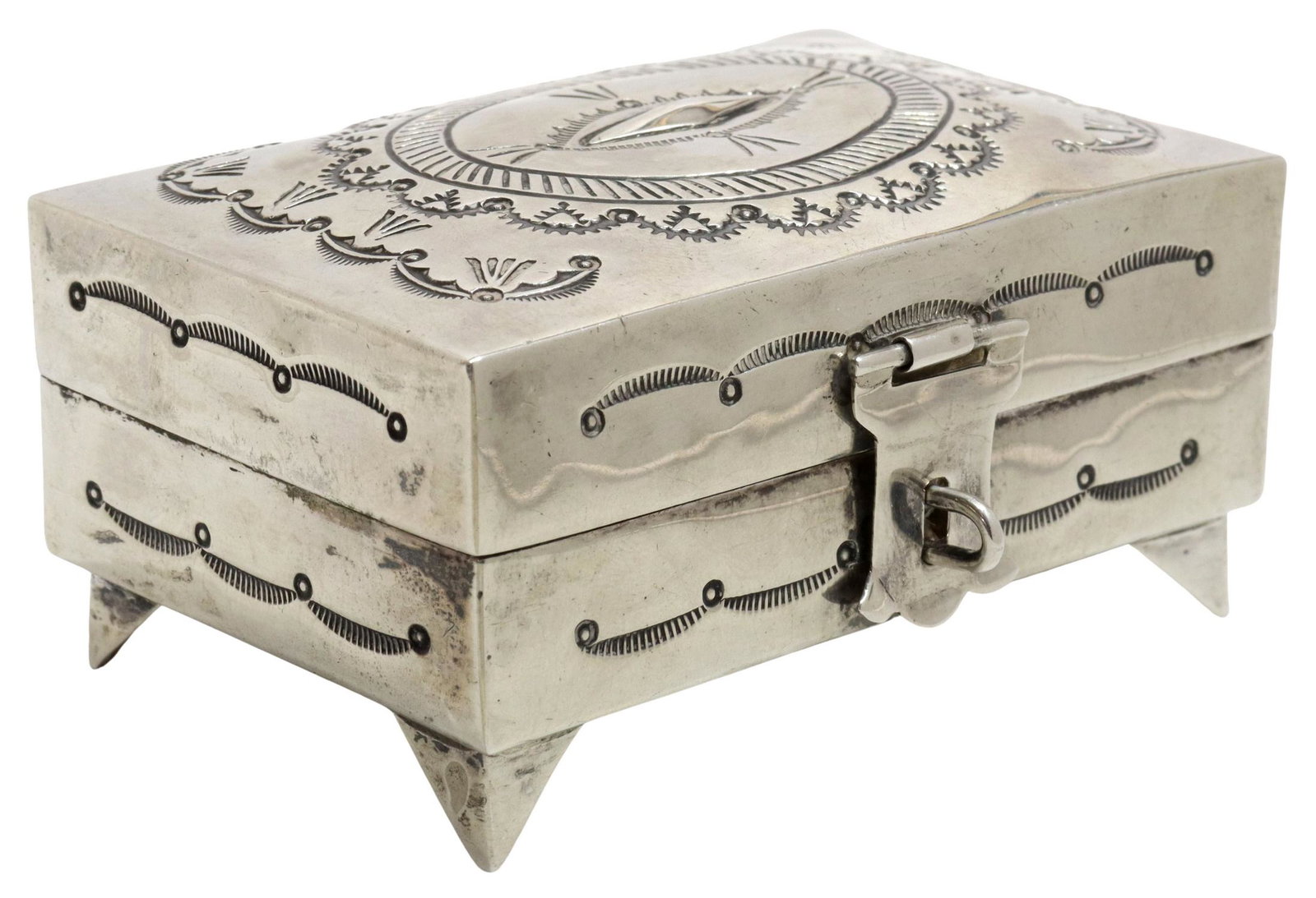 LEONARD JAMES NAVAJO STAMPED SILVER TABLE BOX: Native American silver (content unknown) table/ jewelry box, L. James (Leonard James, Navajo/ Dine, 20th c.), hinged lid with concho design, rising on bracket feet, approx 1.75"h, 3"w, 2"d; 3.24ozt St