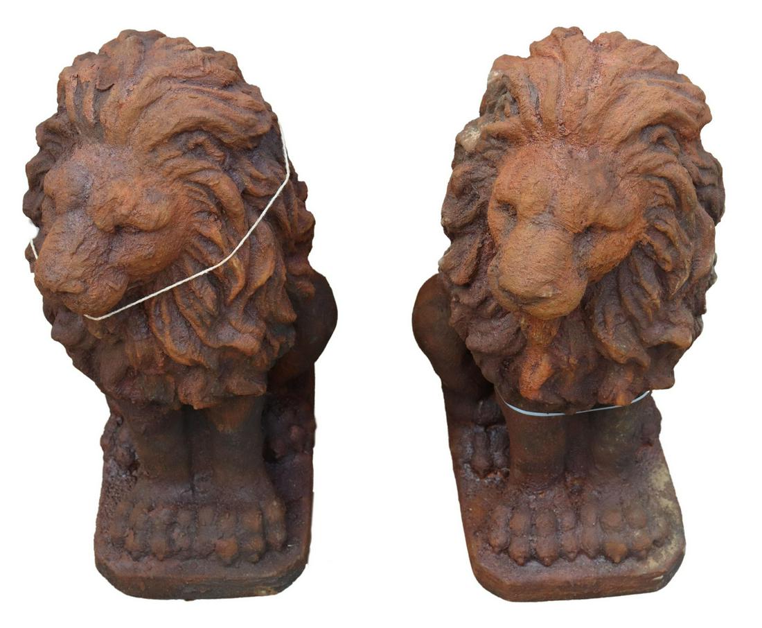 (2) CAST STONE GARDEN FIGURES, SEATED LIONS: (pair) Cast stone garden figures, Seated Lions, each on integral base, in an oxidized finish, approx 20.5"h, 9"w, 12.5"d **PLEASE NOTE: All of the cast stone and garden pieces in this auction have inh