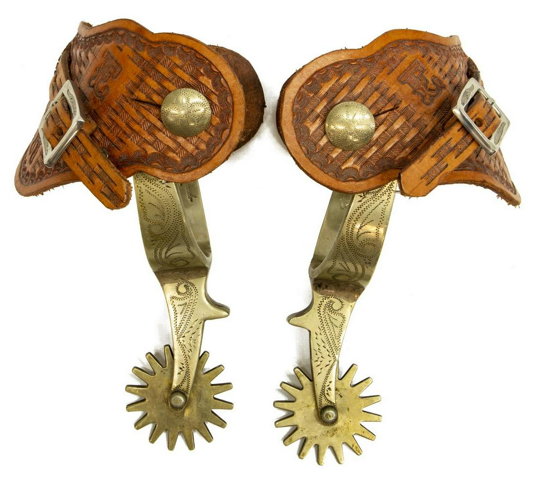 RICARDO NICKEL SILVER COWBOY SPURS: (pair) Ricardo nickel silver cowboy spurs, c.1940s, detailed engraving at outside leather button, outside heel and shank, Ricardo mark at inside of heel, 16 point 2" diameter rowels, Al Stohlman bib l