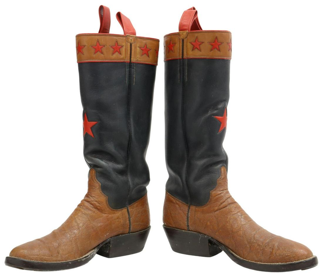 (PR) WHEELER BOOT CO. CUSTOM STAR COWBOY BOOTS: (pair) Custom made cowboy boots, Wheeler Boot Company, Houston, Texas, smooth and textured leather boot with red stars on the shaft, red side straps, Ortho O'Sullivan Ease heel, accompanied by Wheeler