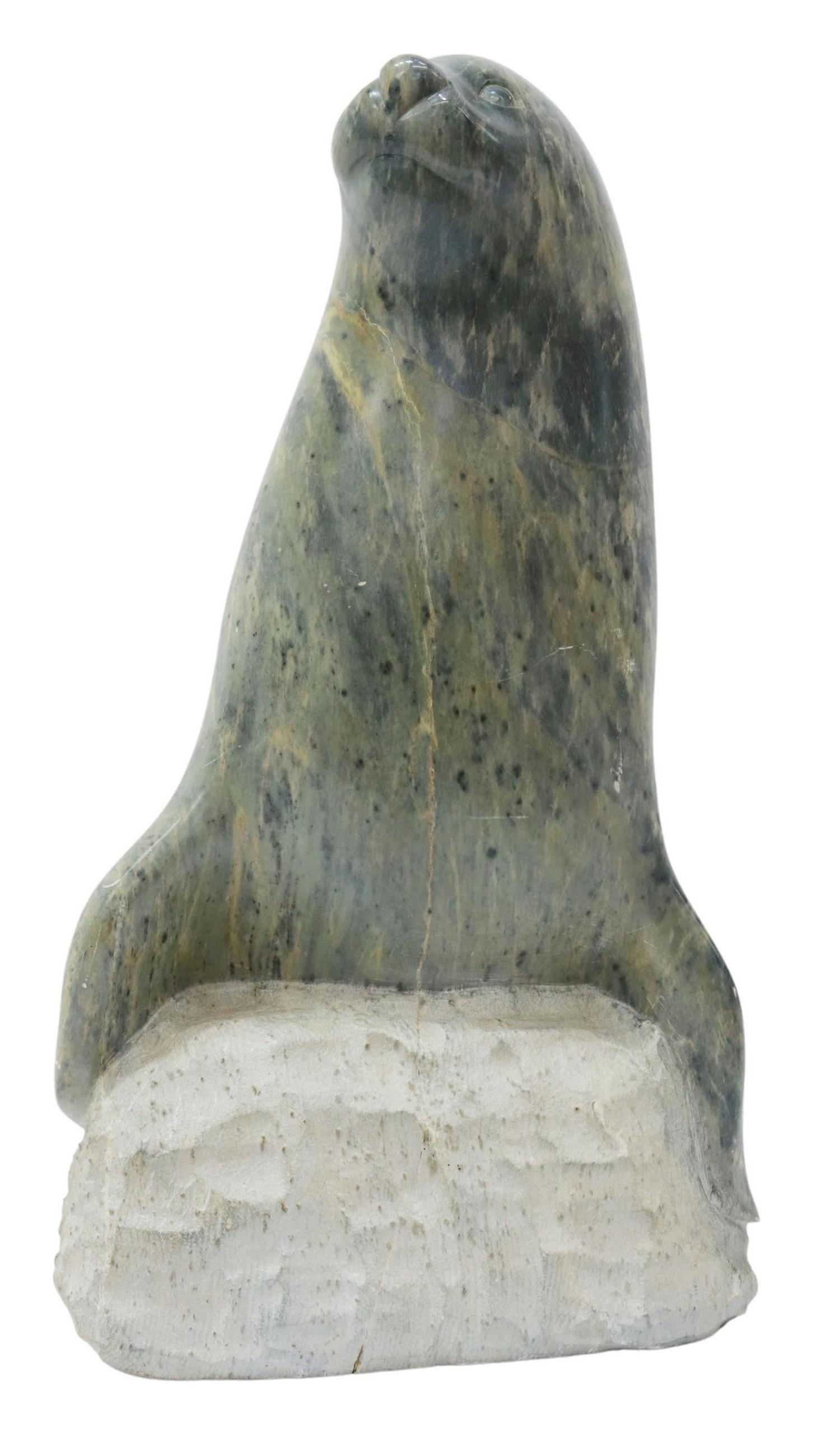 CONSTANCE SHIELDS CARVED SOAPSTONE SEAL SCULPTURE: Carved soapstone wildlife sculpture, Seal, signed Constance Shields (American, 20th c.), dated 1990, approx 18.5"h, 57.5lbs Start Price: $150.00