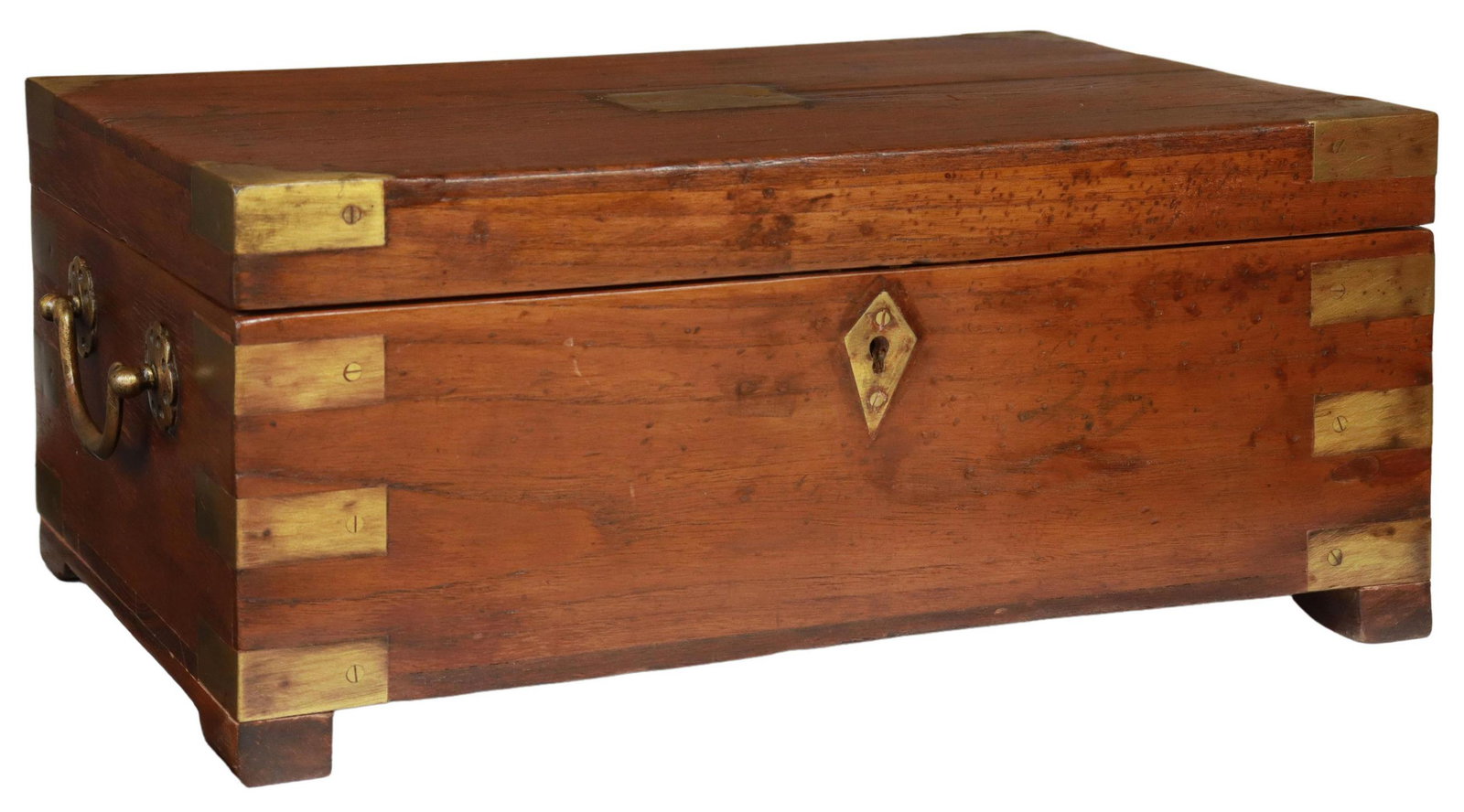 BRITISH COLONIAL BRASS-BOUND TEAK FITTED BOX: British Colonial brass-bound teak fitted box, early 20th c., hinged top opening to interior gallery, brass handles to exterior, rising on bracket feet, split to top, approx 7.5"h, 16.25"w, 11"d, 9.5lb