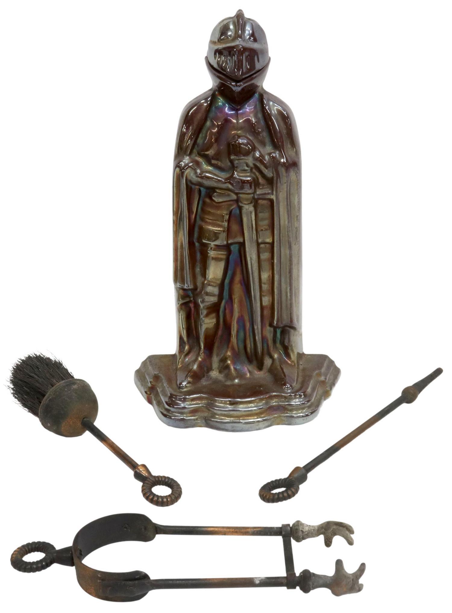 ENGLISH ENAMELED CAST IRON FIREPLACE KNIGHT: English enameled cast iron knight fireplace set, early 20th c., helmet lifts up, open back contains brush, poker and tongs, marked underfoot, approx 14.75"h, 8.5"w, 5.75"d; 11lbs total Start Price: $1