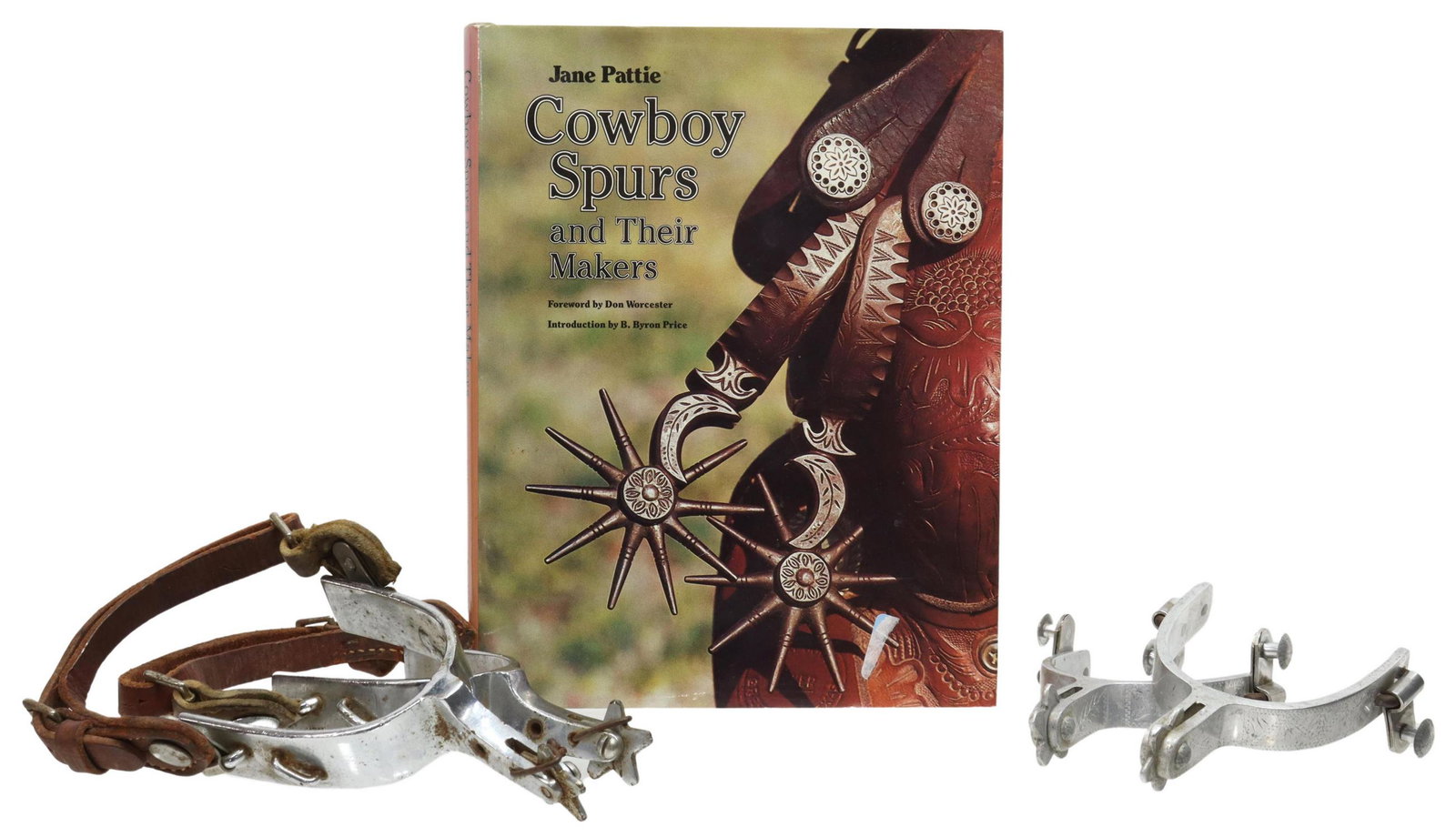 WESTERN CROCKETT & KELLY SPURS, SPUR HISTORY BOOK: (lot) Western spurs and book on the history of cowboy spurs, comprising: (1) pair of aluminum Crockett spurs, with geometric engraving to outer sides, marker's mark stamped to sides, five point 1" row