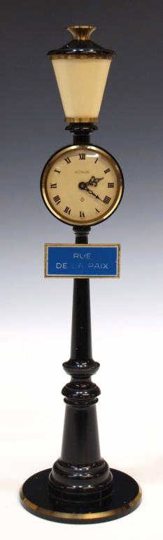 VINTAGE JAEGER LECOULTRE STREET LAMP CLOCK: Vintage Jaeger Le Coultre clock, Swiss, 1960's, a street lamp form mounted with a sign: Rue De La Paix, black with gilt accents, white face with Roman numerals, 8 day wind up works bearing the number 