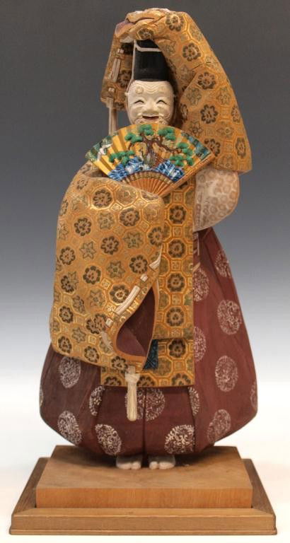 FINE JAPANESE CARVED WOOD NOH DRAMA FIGURE DOLL: Japanese carved wood figure of a Noh drama performer, finely detailed figure of a man in traditional dress with kabuki mask, polychrome painted with gilt painted accents, exquisite detail down to fabr