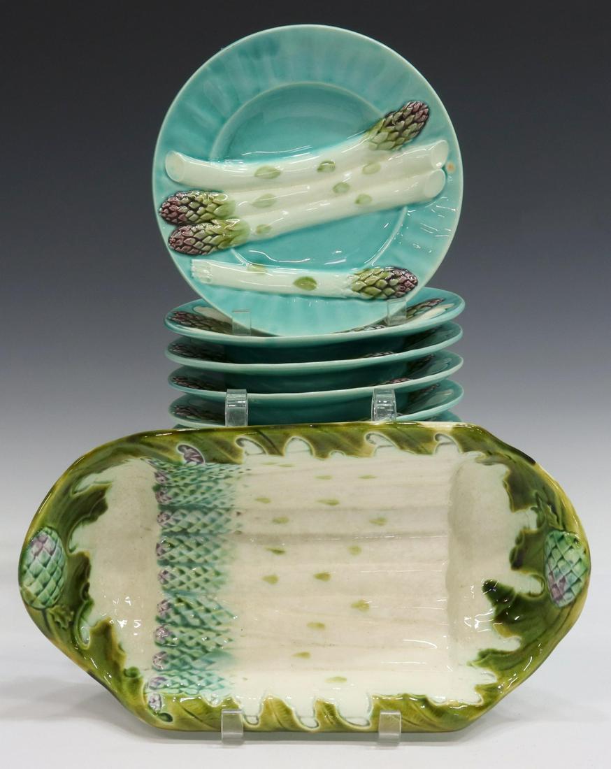 (12) FRENCH MAJOLICA ASPARAGUS CRADLE & PLATES: (lot of 12) French majolica asparagus service, assembled, including: (11) individual plates, Keller and Guerin, Luneville, turquoise glazed ground with molded asparagus stalks and sauce well, approx 8