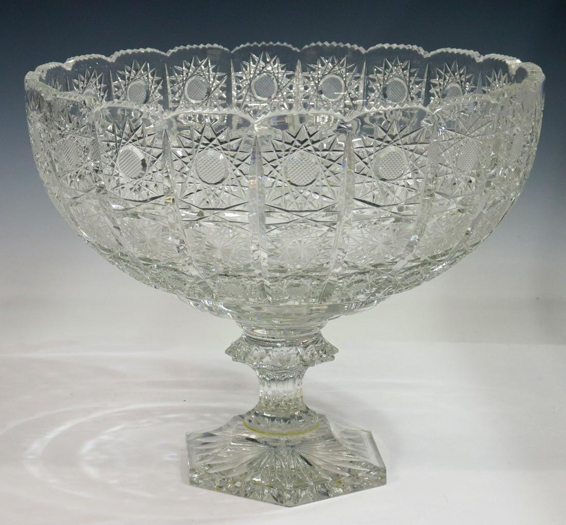 LARGE COLORLESS CUT CRYSTAL COMPOTE, 9.5"H: Large colorless cut crystal compote/ centerpiece bowl, late 20th c., possibly Turkish, with saw tooth rim, star pattern, rising on pedestal foot over hexagonal base, illegible signature on foot, appro