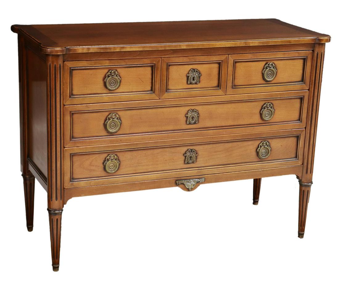 FRENCH LOUIS XVI STYLE FRUITWOOD 3-DRAWER COMMODE: French Louis XVI style fruitwood commode, 20th c., three drawers, rising on tapered fluted legs, approx 32.25"h, 43.75"w, 18"d Start Price: $300.00
