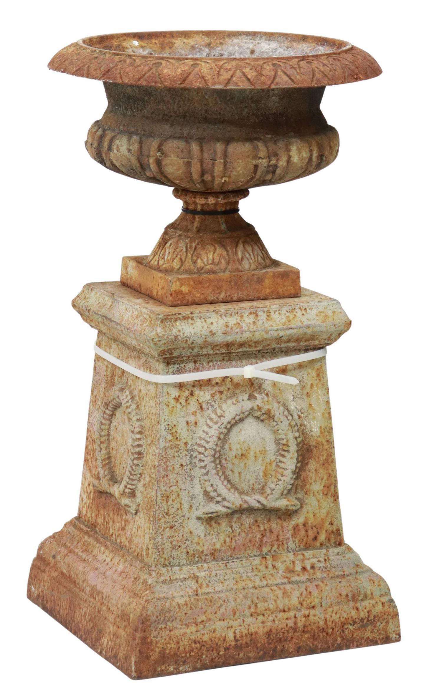 (LOT) FRENCH CAST IRON JARDINIERE ON PEDESTAL: French cast iron jardiniere/ planter on pedestal, (1) campana form urn, with egg and dart trim, over bead and reel molded body, rising on (1) pedestal with laurel wreath accents, oxidized with remnant