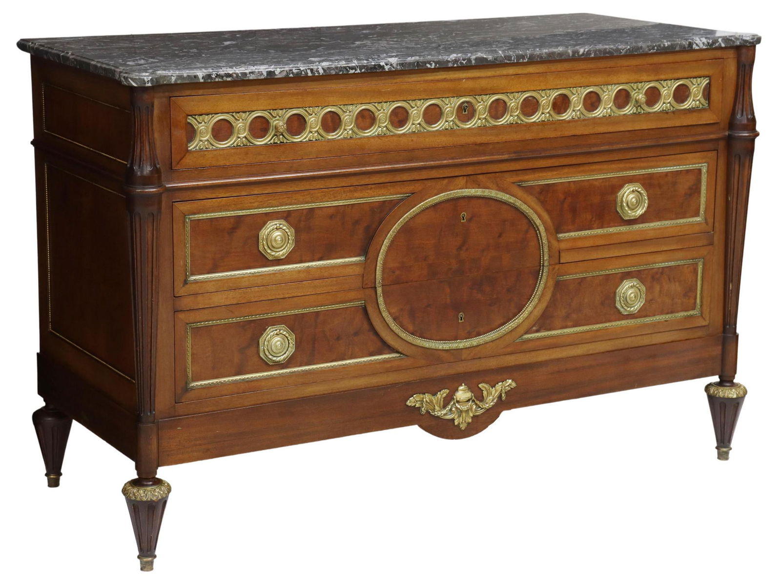 FRENCH LOUIS XVI STYLE MARBLE-TOP MAHOGANY COMMODE: French Louis XVI style marble-top mahogany commode, late 19th c., embellished with brass ormolu, three drawers flanked by half ribbed columns, descending to turned legs, approx 33.5"h, 52"w, 21.75"d S