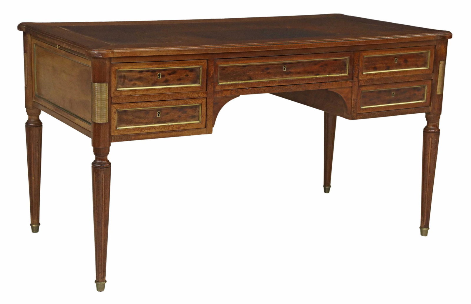 FRENCH LOUIS XVI STYLE LEATHER-TOP WRITING DESK: French Louis XVI style writing desk, late 19th c., having an inset leather writing surface, over five drawers, rising on tapered ribbed legs with brass-capped feet, tears and stains to leather, approx