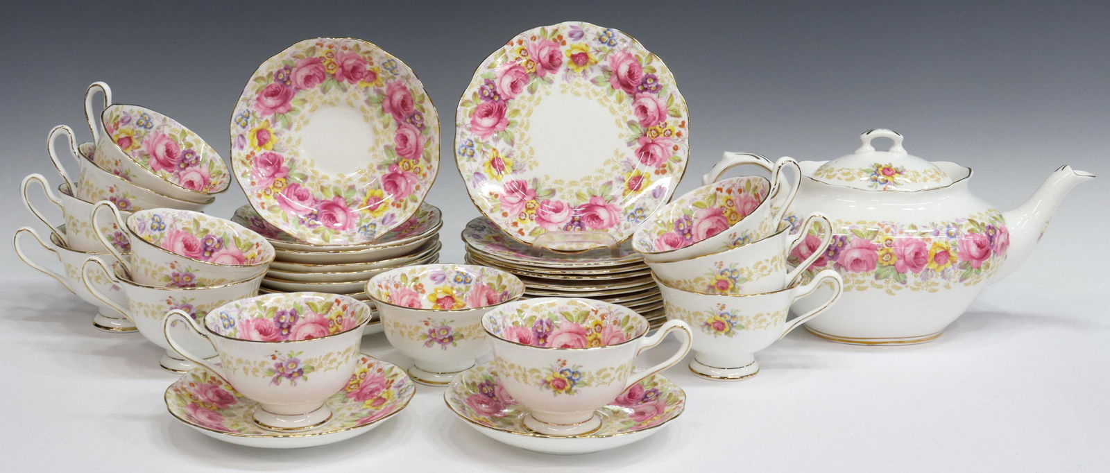 (37) ROYAL ALBERT SERENA BONE CHINA TEA SERVICE: (lot of 37) English bone china tea service, Royal Albert, in the "Serena" pattern, chintzware style pattern with pink roses, including: (12) dessert plates, 6.25"diam, (11) footed cups, (12) saucers,