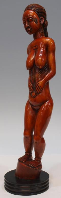 CARVED AFRICAN IVORY NUDE FEMALE FIGURE: **International shipping is not available for this item. This item will only be shipped within the United States.** African ivory tusk, carved in the form of an 18" tall female nude, overall: 19"h, 3.