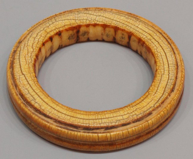 ANTIQUE IVORY TUSK BRACELET, 19TH C.: ***NOTE--This item will not be shipped outside of the United States--There will be no International shipping on this item** Patinated ivory tusk bracelet, 19th c., 2-7/8" inside diameter, 4.25" outsid