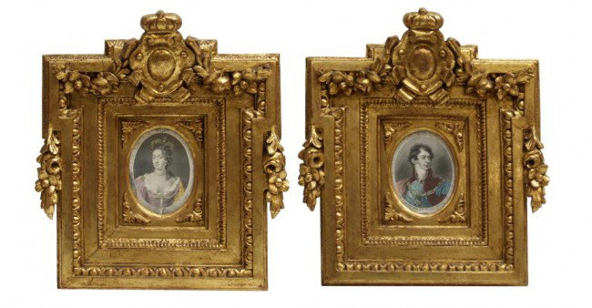 (2) ELABORATE SPANISH GILTWOOD FRAMES, LITHOGRAPHS: (lot of 2) Spanish lithographs in elaborate giltwood frames, early 1800's, each frame with a central armorial crest flanked by floral garlands, stepped inward to a, oval picture of royalty, sight: 5"h