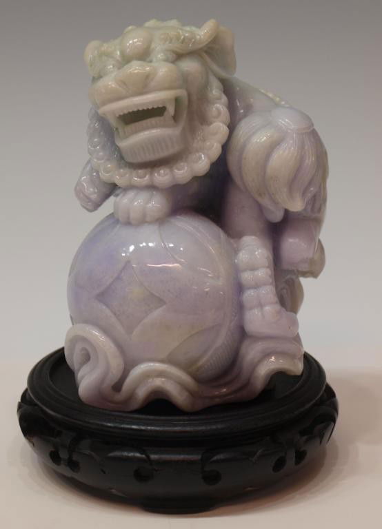 CHINESE LAVENDER & GREEN JADEITE FOO LION CARVING: Chinese lavender and green jadeite figure carved in the form of a male foo lion holding a ball, 5.75"h, 4lbs **Provenance: From the private collection of a Colonel (ret.) in the United States Army. Th