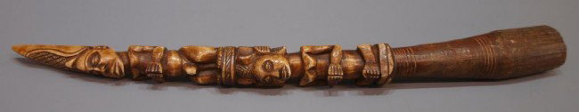 LARGE AFRICAN FIGURAL CARVED IVORY TUSK: ***NOTE--This item will not be shipped outside of the United States--There will be no International shipping on this item***African carved ivory tusk, male and female figures both wearing elaborate he